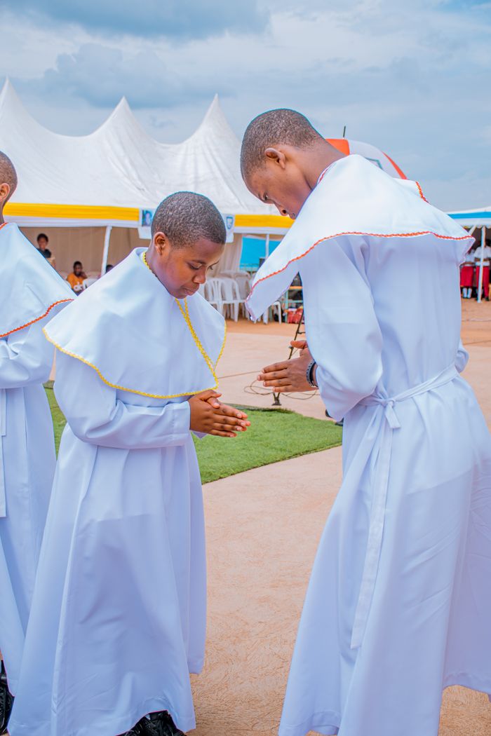 Mastering the First Impression: Your intriguing post title goes here Two men in white ceremonial robes standing and praying outdoors, suggesting a spiritual event or gathering.